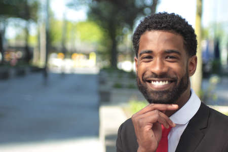 Beautiful businessman outside in the summer