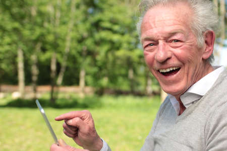 Beautiful old man outsideの写真素材