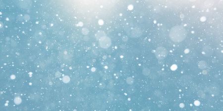 Snow fall flakes on blue backgroundの写真素材