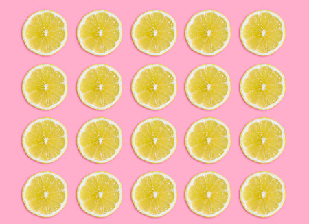 lemon slice top view on pink backgroundの写真素材