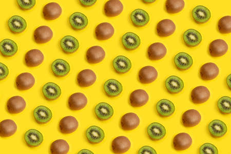 kiwi fruit pattern on yellow background. kiwi slice.