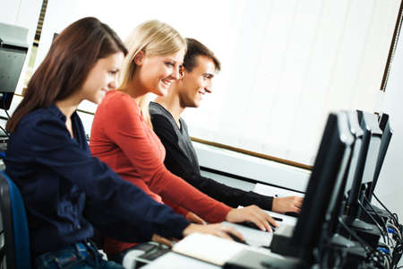 Students learning in computer labの写真素材