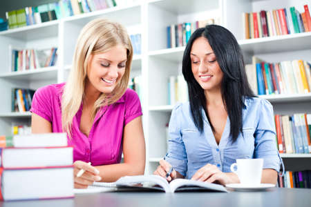 Students learning in libraryの写真素材