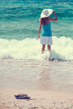 Woman standing in sea, intentionally tonedの写真素材