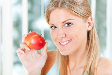 Girl holding an apple, healthy lifestyle conceptの写真素材