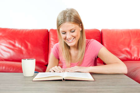 Young woman reading a bookの写真素材