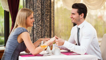 Happy couple having great time at the restaurantの写真素材