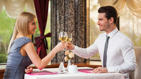 Happy couple having great time at the restaurantの写真素材