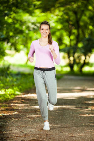 Happy girl joggingの写真素材