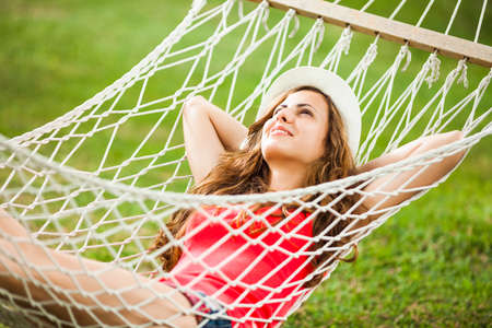 Happy girl resting in hammockの写真素材