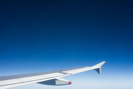 Air view of sky and airplane wingの写真素材