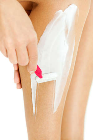 Woman shaving legsの写真素材