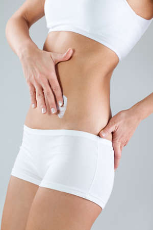 Woman putting skin creamの写真素材