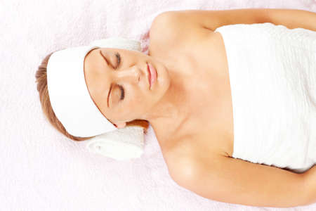 Young woman relaxing after massage on spa treatmentの写真素材