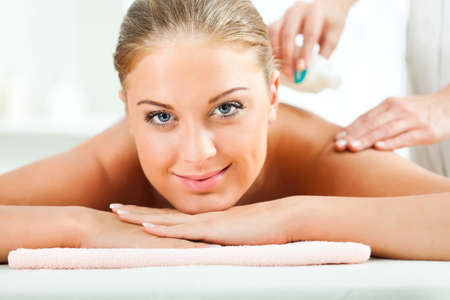 Young woman relaxing on spa treatmentの写真素材
