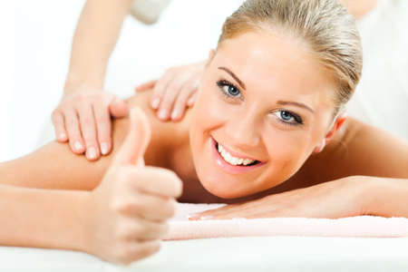 Young woman having massage on spa treatmentの写真素材