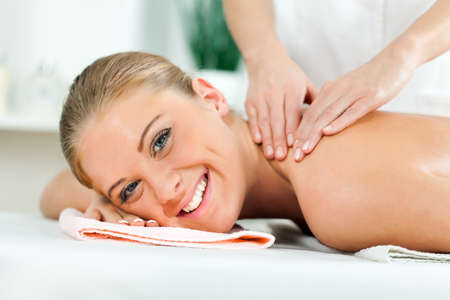 Young woman having massage on spa treatmentの写真素材