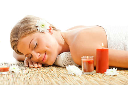 Young woman relaxing after massage on spa treatmentの写真素材