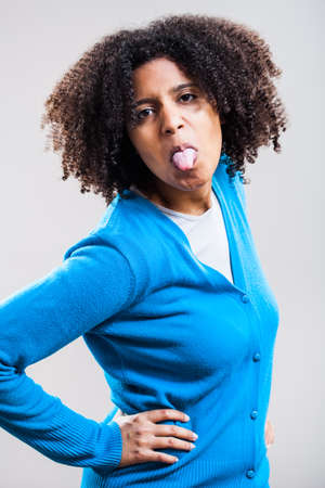 Portrait of woman making faceの写真素材