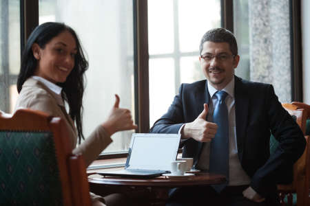 Two happy business persons in meetingの写真素材