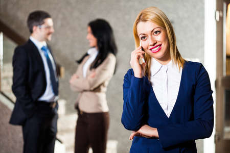 Business people in lobbyの写真素材