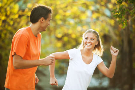 Happy couple jogging outdoorの写真素材