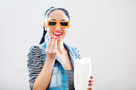 Portrait of girl with 3d glasses and popcorn