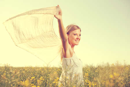 Young woman enjoying summertime intentionally tonedの写真素材
