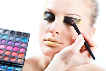 Beautician artist applying makeupの写真素材