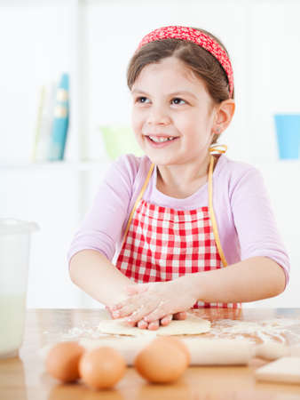 Little girl making the doughの写真素材
