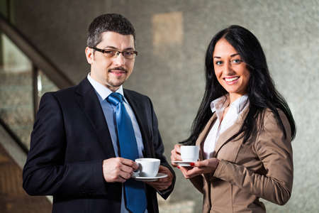 Two business persons having coffeeの写真素材