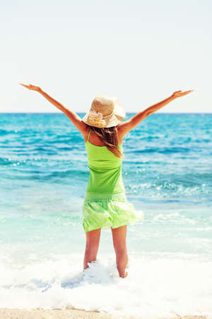 Happy woman standing in seaの写真素材