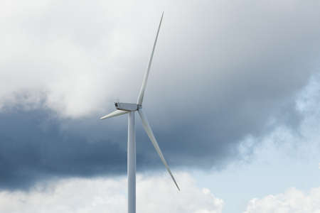 Wind turbine and stormy skyの写真素材