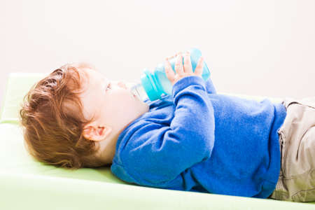 Baby boy drinking waterの写真素材