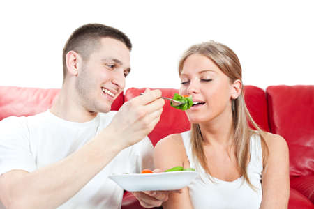 Young couple having breakfastの写真素材