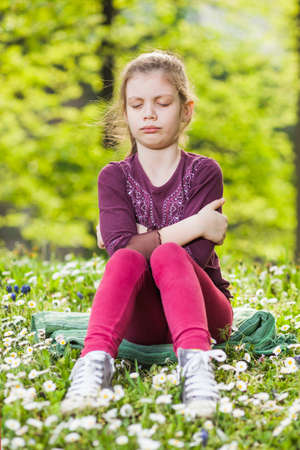 Portrait of angry child in parkの写真素材