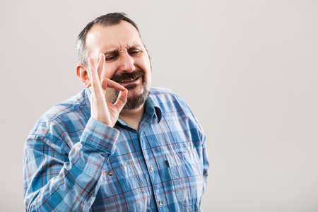 Portrait of man showing ok signの写真素材