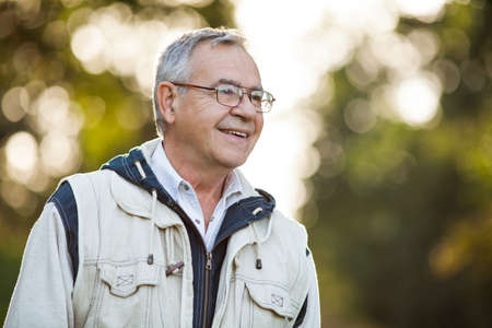 Outdoor portrait of happy senior manの写真素材