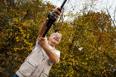 Fisherman casting a hookの写真素材