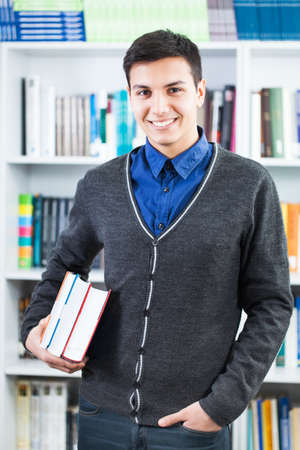 Happy student in libraryの写真素材