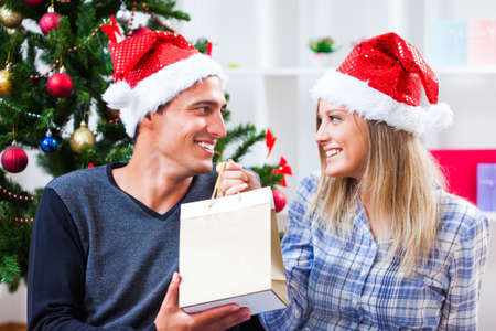 Happy couple celebrating christmasの写真素材
