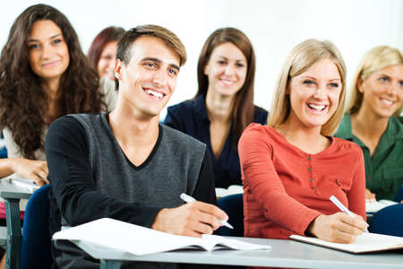 Group of university students learning in classroomの写真素材