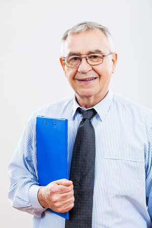 Portrait of successful senior businessman holding documentsの写真素材