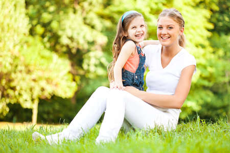 Mother and daughter are having fun in parkの写真素材