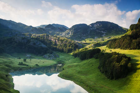 Mountain range and lake early in the morning.の写真素材
