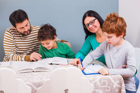 Parents are teaching their children at home.の写真素材