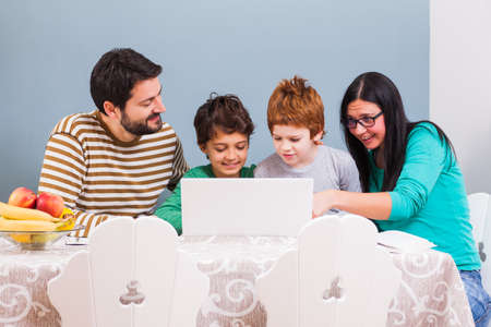 Parents are teaching their children at home.の写真素材