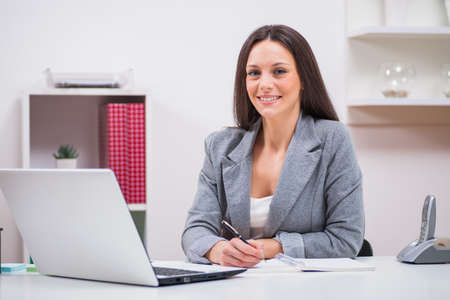 Young businesswoman is working in her office.の写真素材