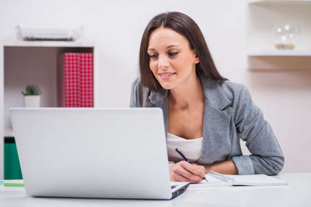 Young businesswoman is working in her office.の写真素材
