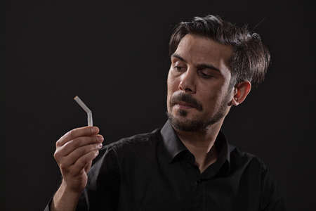 Portrait of adult man who is decided to quit smoking.の写真素材